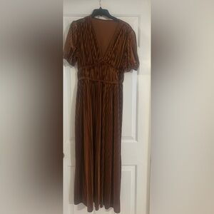 Crushed velvet dress with deep v in front. Color is a bronze. Size medium.